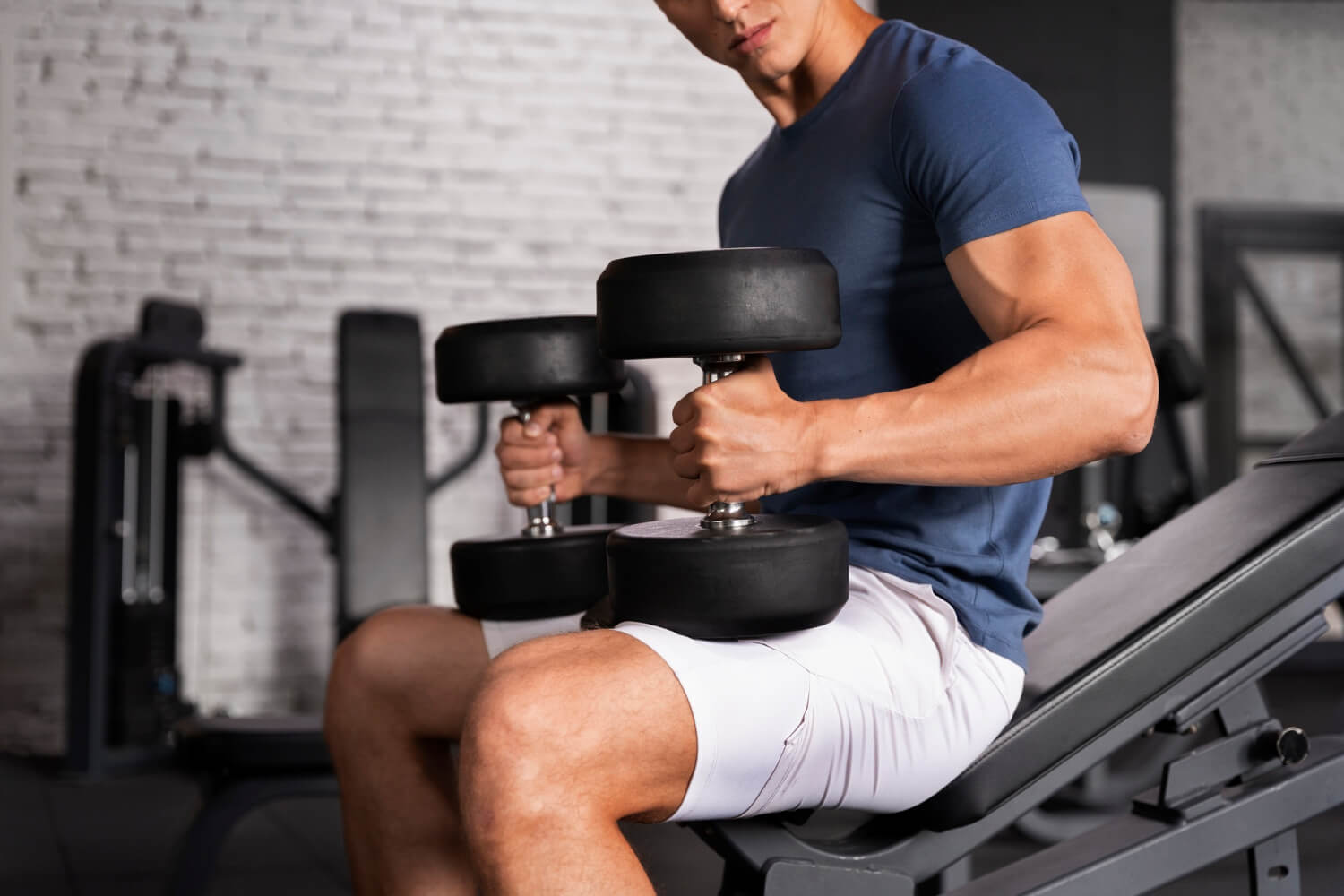 Athlete training with dumbbells